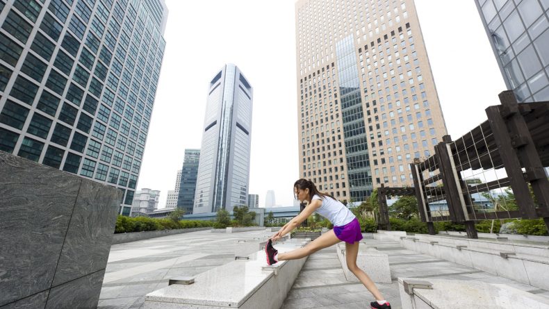 Female exercising in an urban environment
