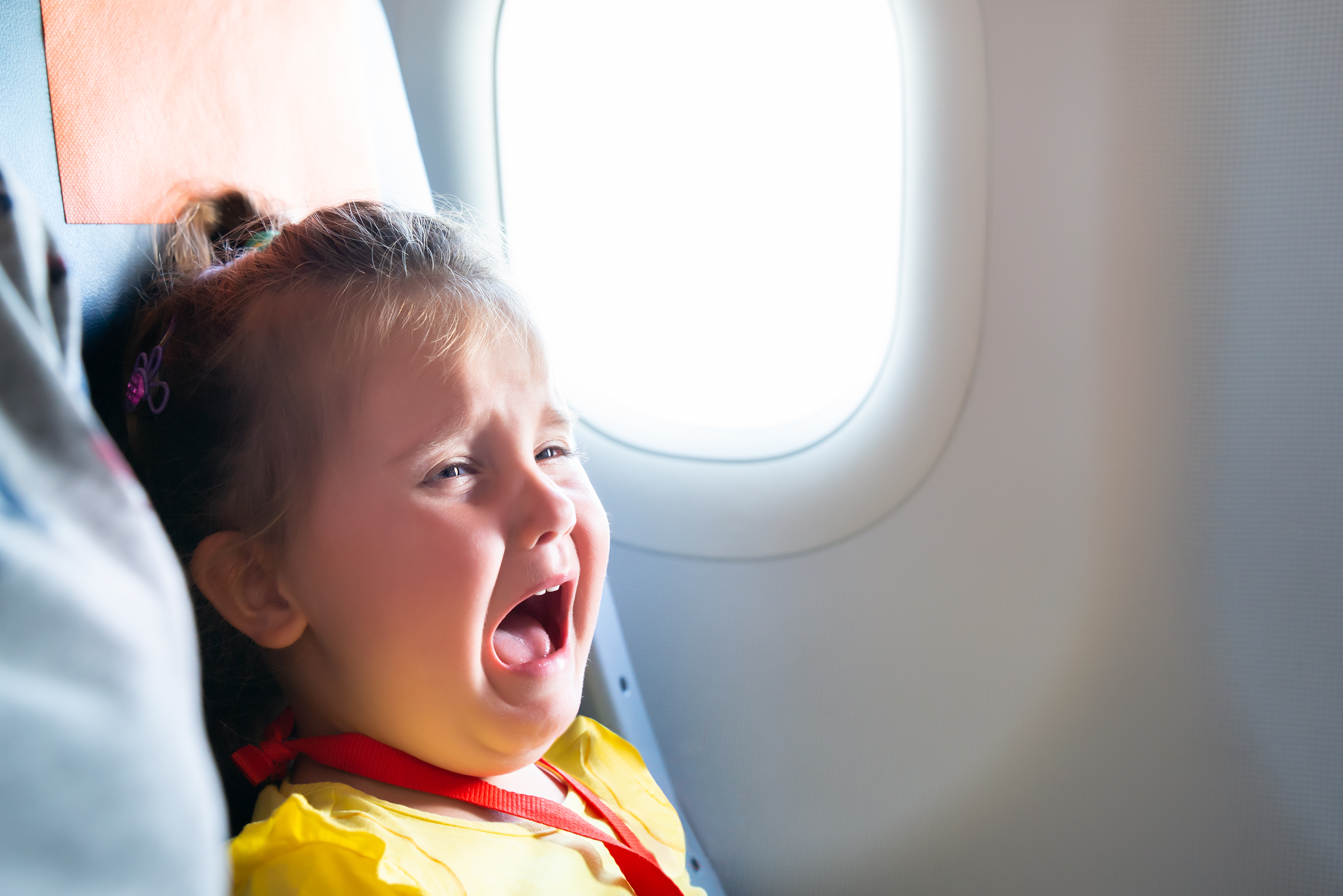 Air Travel With Kids: a little girl crying
