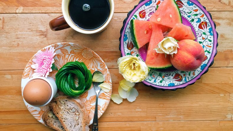 Breakfast of avocado toast and watermelon beautifully presented