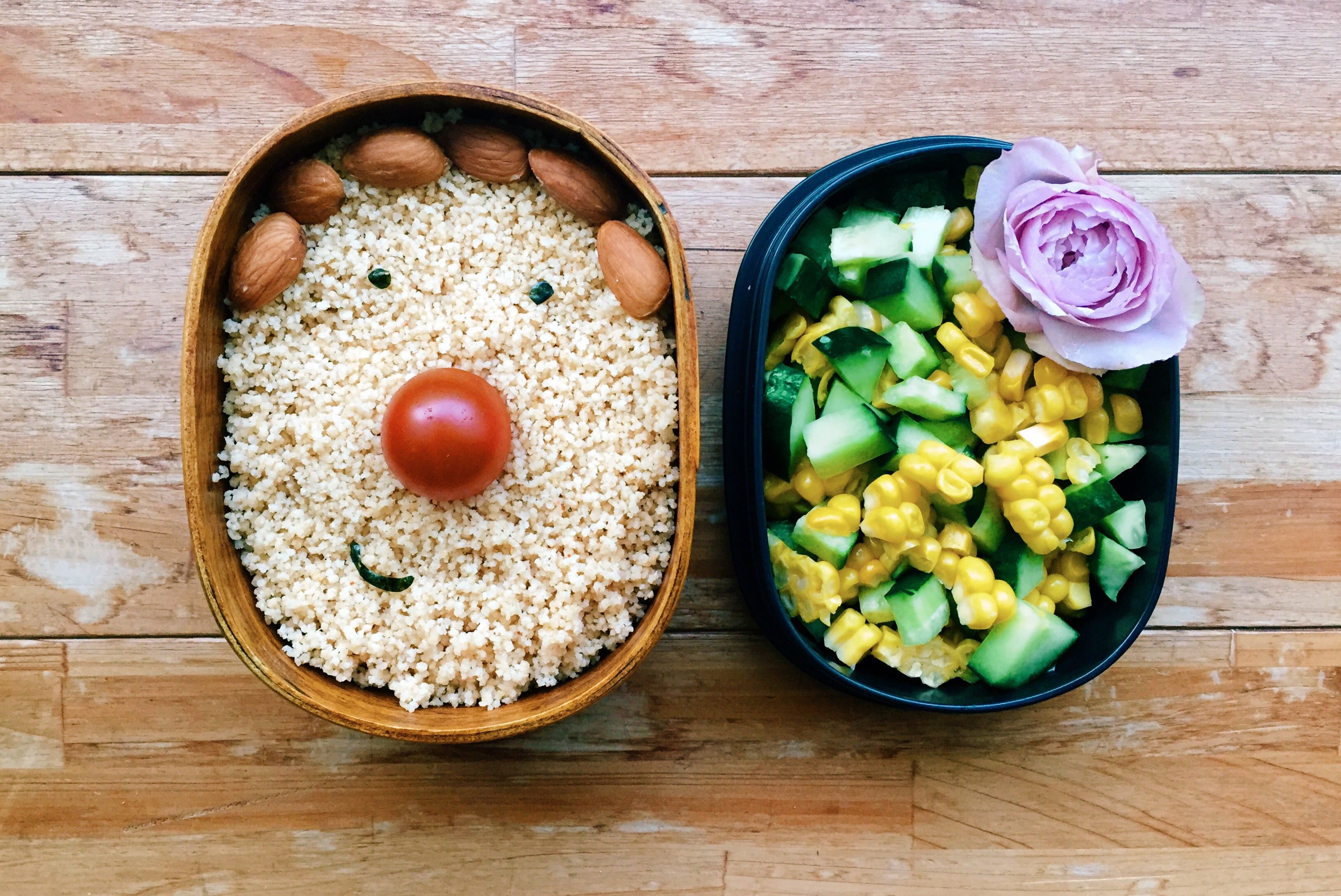 A bento with almonds, brown rice and corn
