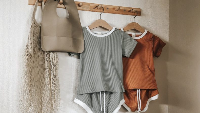 10 Aesthetically Pleasing House Décor Items Under ¥1000 - Baby clothes on a wood hook