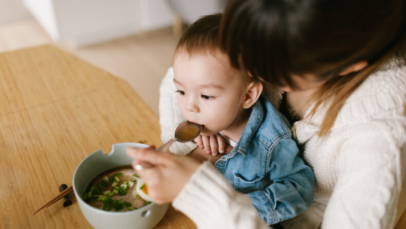 Asian baby eating a breakfast Photograph by Anek Suwannaphoom