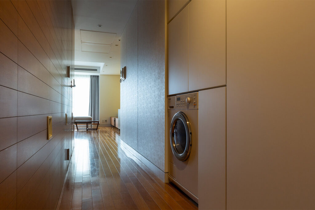 The room has a washing machine. Laundry service is also available at the front desk.