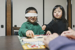 Playing Fukuwarai a Traditional New Year Games