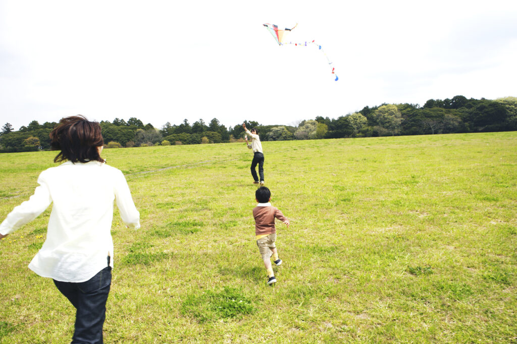 Family playing with takoage kite