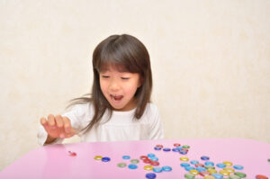 Girl playing with Ohajiki